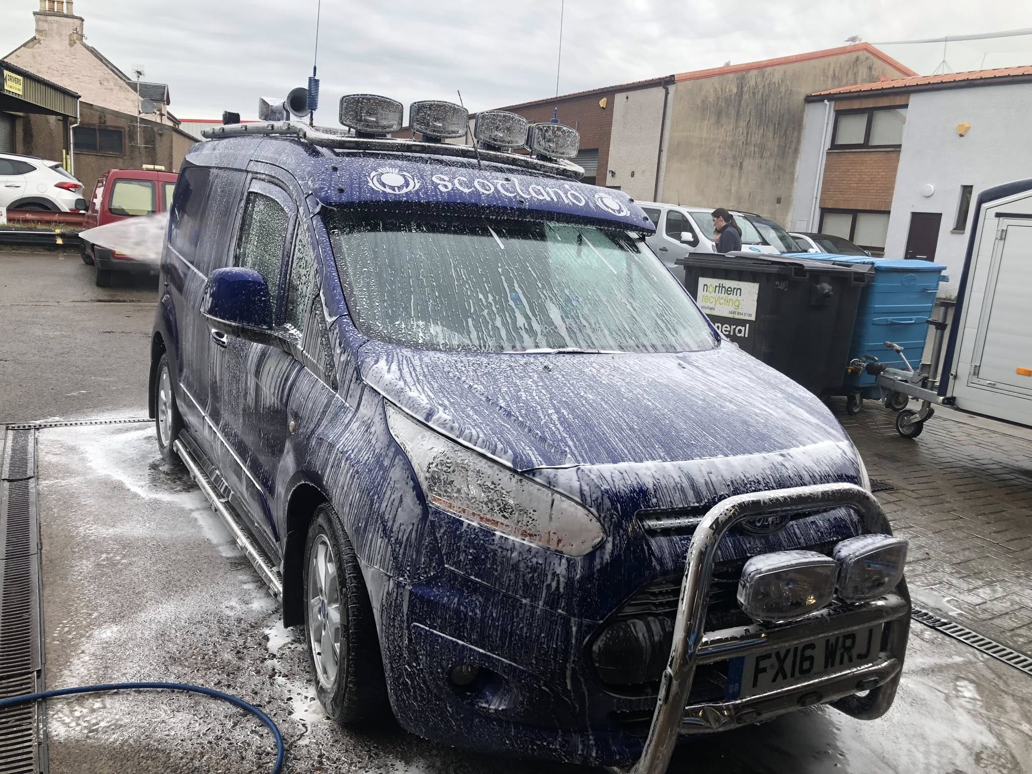 Mid-wash on a livery-wrapped van